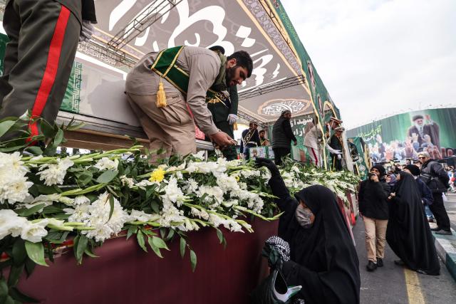 Iranians attend the funeral of Iran's Revolutionary Guards Corps (IRGC) commanders, army commanders and others killed in the early days of the United States and Israeli strikes on Iran, at Enghelab Square in Tehran on March 11, 2026. Washington launched strikes with Israel on Iran on February 28, sparking retaliatory strikes by Tehran against Israel and US bases across the Gulf region. (Photo by Atta KENARE / AFP) / Attention editors: Photo taken with approval from the Ministry of Culture and Islamic Guidance (Ershad) --
AFP covers the war in the Middle East through its extensive regional network, including bureaus in Tehran, Jerusalem, and several neighboring countries. Since the start of the conflict, journalists have been working under increasingly restrictive conditions. Authorities in several countries have limited reporters' movements, photo and live video coverage from sensitive locations. Some governments and armed groups have banned images of missile or drone strikes and other security-related sites. / 