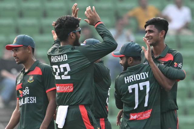 Bangladesh's Nahid Rana (R) celebrates with teammates after taking the wicket of Pakistan's Salman Agha during the first one-day international (ODI) cricket match between Bangladesh and Pakistan at Sher-e-Bangla National Stadium in Mirpur on March 11, 2026. (Photo by MUNIR UZ ZAMAN / AFP)