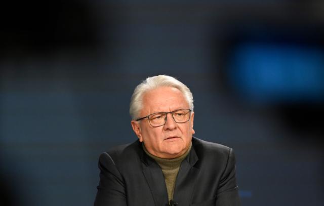 The CEO of German automotive and arms manufacturer Rheinmetall Armin Papperger attends a virtual press conference to present the company's 2025 annual results at the company's headquarters in Duesseldorf, western Germany, on March 11, 2026. (Photo by INA FASSBENDER / AFP)