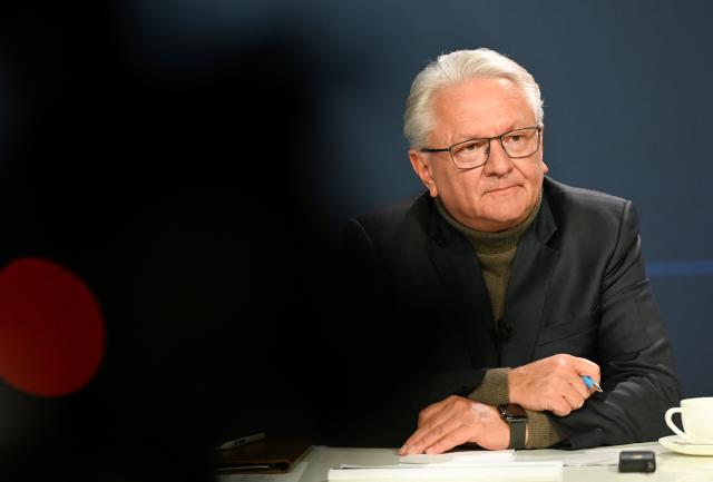 The CEO of German automotive and arms manufacturer Rheinmetall Armin Papperger attends a virtual press conference to present the company's 2025 annual results at the company's headquarters in Duesseldorf, western Germany, on March 11, 2026. (Photo by INA FASSBENDER / AFP)