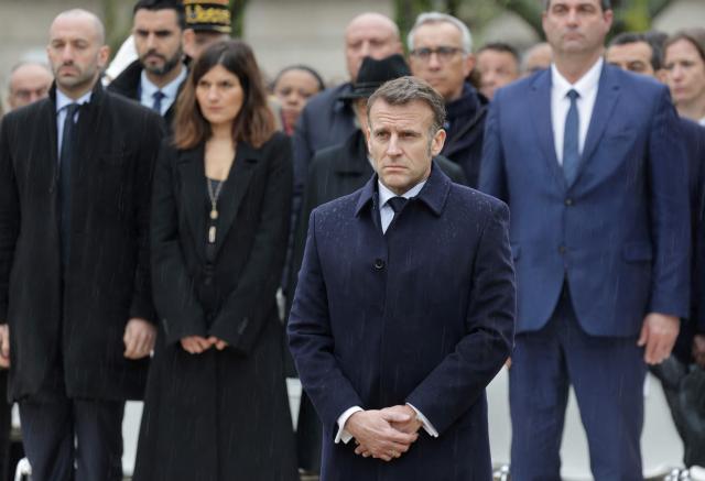 French President Emmanuel Macron stands in front of a commemorative fountain during a ceremony paying tribute to the victims of terrorism at Les Invalides in Paris on March 11, 2026. (Photo by Ludovic MARIN / POOL / AFP)