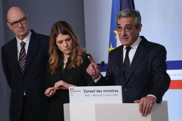France's Trade Minister Serge Papin (R) addresses media, accompanied by France's Economy and Finance Minister Roland Lescure (L) and France's Government Spokesperson Maud Bregeon (C) during a press conference following the weekly cabinet meeting in Paris on March 11, 2026. (Photo by Thomas SAMSON / AFP)