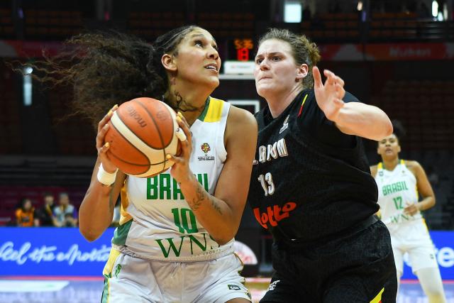 Brazil's Kamilla Cardoso (L) and Belgium's Kyara Linskens fight for the ball during the FIBA Women's Basketball World Cup 2026 qualifying tournament match between Brazil and Belgium in Wuhan, in China's central Hubei province, on March 11, 2026. (Photo by CN-STR / AFP) / China OUT