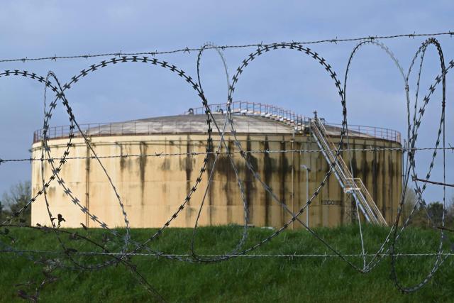 This photograph shows a tank at an oil deposit in Vern-sur-Seiche, western France on March 11, 2026. Oil prices rose again after stabilizing on March 10, 2026, with global benchmark Brent up 1.8 percent to over $85 a barrel and US contract WTI up more than two percent, after prices earlier reached highs near $120. (Photo by Damien MEYER / AFP)