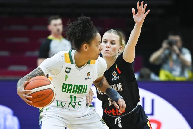 Brazil's Emanuely Oliveira (L) and Belgium's Julie Vanloo  fight for the ball during the FIBA Women's Basketball World Cup 2026 qualifying tournament match between Brazil and Belgium in Wuhan, in China's central Hubei province, on March 11, 2026. (Photo by CN-STR / AFP) / China OUT