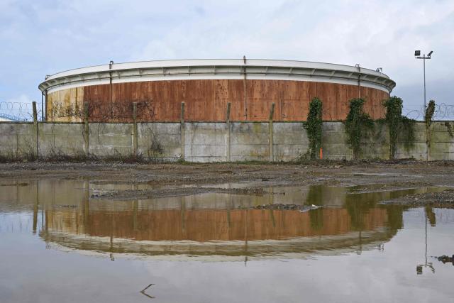 This photograph shows a tank at an oil deposit in Vern-sur-Seiche, western France on March 11, 2026. Oil prices rose again after stabilizing on March 10, 2026, with global benchmark Brent up 1.8 percent to over $85 a barrel and US contract WTI up more than two percent, after prices earlier reached highs near $120. (Photo by Damien MEYER / AFP)