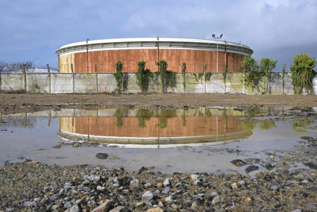This photograph shows a tank at an oil deposit in Vern-sur-Seiche, western France on March 11, 2026. Oil prices rose again after stabilizing on March 10, 2026, with global benchmark Brent up 1.8 percent to over $85 a barrel and US contract WTI up more than two percent, after prices earlier reached highs near $120. (Photo by Damien MEYER / AFP)
