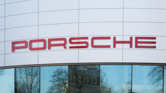 (FILES) The Porsche logo is seen outside the premises of the "Exclusive Manufaktur" of German luxury car maker Porsche, where clients can get their vehicles customized in Stuttgart - Zuffenhausen on March 6, 2025. Porsche reiterated at a press conference on March 11, 2026 a desire to “extend the lifespan of its combustion and hybrid engines,” in the face of a slower-than-expected adoption of electric vehicles in Europe and the United States. (Photo by SILAS STEIN / AFP)
