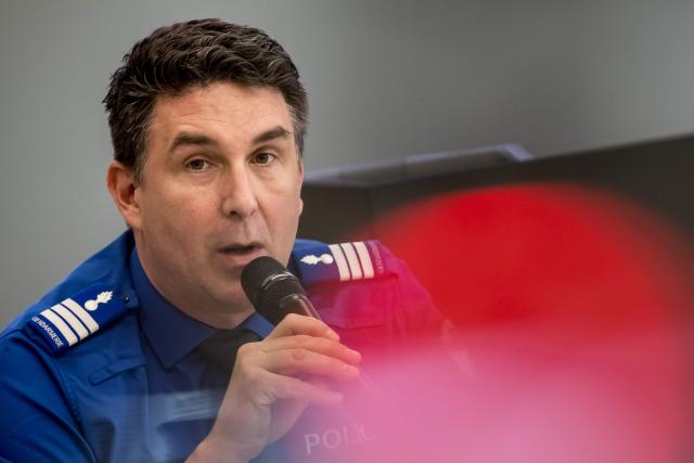 Head of the Police of the Canton of Fribourg Philippe Allain speaks during a press conference on March 11, 2026 in Fribourg, western Switzerland, after a bus caught fire in Kerzers on March 10, 2026 killing at least six people and injuring five others in what police said may have been a deliberate act. (Photo by Fabrice COFFRINI / AFP)