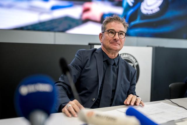 Attorney general of the Canton of Fribourg Raphael Bourquin looks on during a press conference on March 11, 2026 in Fribourg, western Switzerland, one day after a bus caught fire in Kerzers killing at least six people and injuring five others in what police said may have been a deliberate act. (Photo by Fabrice COFFRINI / AFP)