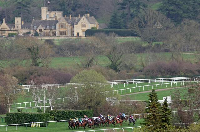 Runners and riders compete in the Turners Novices' Hurdle horse race on the second day of the Cheltenham Festival at Cheltenham Racecourse, in Cheltenham, western England on March 11, 2026. (Photo by Adrian Dennis / AFP)