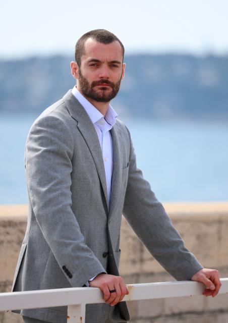 Menton's right wing French mayoral candidate for the list 'Menton Revival' (Renouveau Mentonnais) Louis Sarkozy poses during a photo session in Menton, southeastern France on March 11, 2026. (Photo by Valery HACHE / AFP)