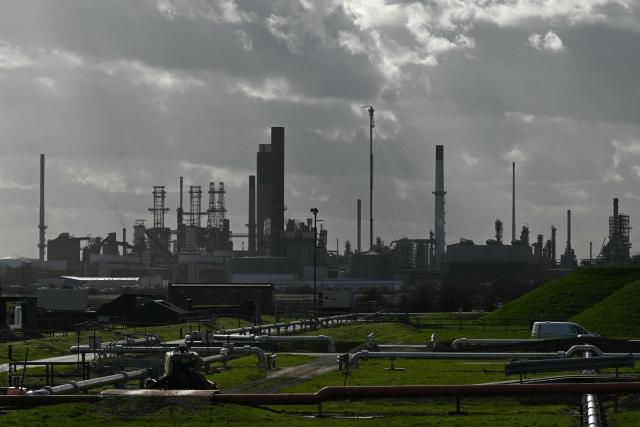 This general view shows the Humber Refinery (top), operated by Phillips 66, near South Killingholme, north-east England on March 11, 2026. World oil prices surged more than five percent on March 11 as the Middle East war disrupted crude exports. (Photo by Oli SCARFF / AFP)