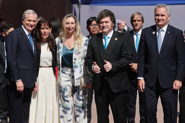 (From L) Chile's President-elect Jose Antonio Kast, his wife Maria Pia Adriasola, Argentina's Secretary General of the Presidency Karina Milei, Argentina's President Javier Milei and Argentine Minister of Foreign Affairs Pablo Quirno pose for a photo upon arrival at the inauguration ceremony of Chile's new President Jose Antonio Kast at the National Congress in Valparaiso, Chile on March 11, 2026. Chile's most right-wing president in over three decades, Jose Antonio Kast, takes office on March 11, 2026, on a promise to tackle surging rates of violent crime and carry out mass migrant deportations. (Photo by Javier TORRES / AFP)