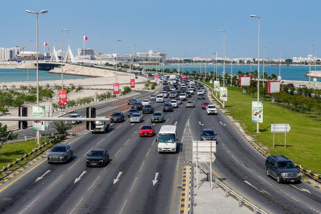 Vehicles move on a highway by the Muharraq Bridge in Bahrain's capital Manama on March 11, 2026. Iran's Revolutionary Guards said on March 11 that they had targeted several US bases in Kuwait and Bahrain during the war with the United States and Israel. (Photo by AFP) / 