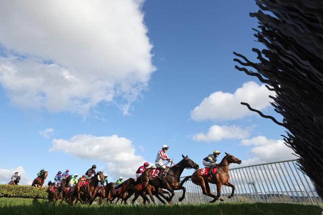 Final Orders ridden by Jockey Conor Stone-Walsh (R) leads the pack to win the Glenfarclas Cross Country Chase horse race on the second day of the Cheltenham Festival at Cheltenham Racecourse, in Cheltenham, western England on March 11, 2026. (Photo by Adrian DENNIS / AFP)