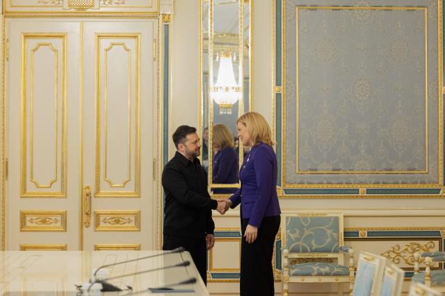 Ukraine's President Volodymyr Zelensky (L) shakes hands with the President of the Bundestag Julia Kloeckner (R) before a press conference in Kyiv on March 11, 2026, amid the Russian invasion of Ukraine. (Photo by Tetiana DZHAFAROVA / AFP)