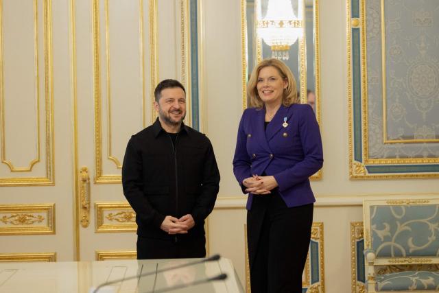 Ukraine's President Volodymyr Zelensky (L) stands next to the President of the Bundestag Julia Kloeckner (R) before a press conference in Kyiv on March 11, 2026, amid the Russian invasion of Ukraine. (Photo by Tetiana DZHAFAROVA / AFP)