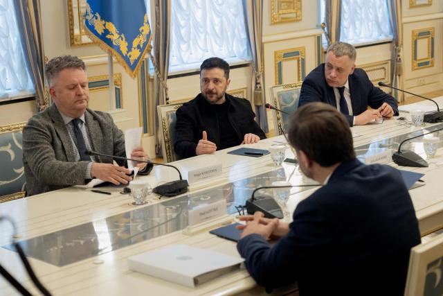 Ukraine's President Volodymyr Zelensky (C) and President of the Bundestag Julia Kloeckner (unseen) attend a press conference in Kyiv on March 11, 2026, amid the Russian invasion of Ukraine. (Photo by Tetiana DZHAFAROVA / AFP)