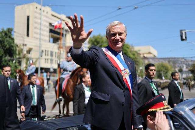 Chile's new President Jose Antonio Kast waves from the presidential convertible car after his inauguration ceremony in Valparaiso, Chile, on March 11, 2026. Chile's most right-wing president in over three decades, Jose Antonio Kast, takes office on March 11, 2026, on a promise to tackle surging rates of violent crime and carry out mass migrant deportations. (Photo by Javier TORRES / AFP)