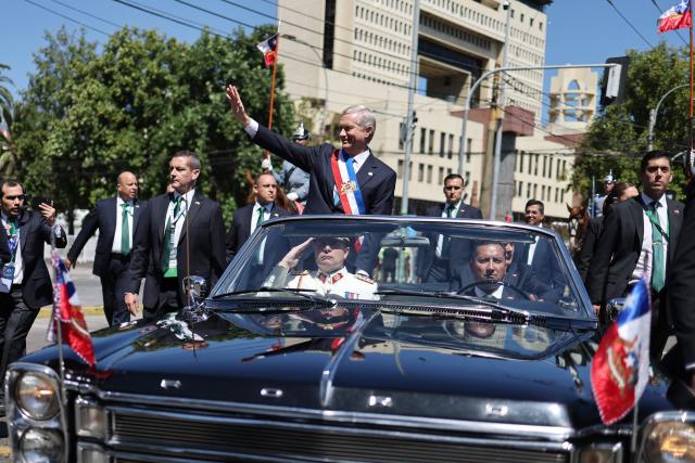 Chile's new President Jose Antonio Kast waves from the presidential convertible car after his inauguration ceremony in Valparaiso, Chile, on March 11, 2026. Chile's most right-wing president in over three decades, Jose Antonio Kast, takes office on March 11, 2026, on a promise to tackle surging rates of violent crime and carry out mass migrant deportations. (Photo by Javier TORRES / AFP)