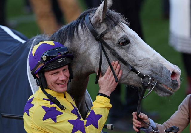 Jockey Paul Townend celebrates with racehorse Il Etait Temps after winning the Queen Mother Champion Chase horse race on the second day of the Cheltenham Festival at Cheltenham Racecourse, in Cheltenham, western England on March 11, 2026. (Photo by Adrian Dennis / AFP)