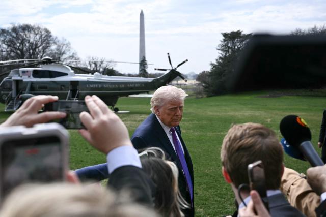 US President Donald Trump speaks to reporters before boarding Marine One as he departs from the South Lawn of the White House in Washington, DC, on March 11, 2026. Trump will be making multiple stops in Kentucky and Ohio including Thermo Fisher Scientific and Verst Logistics. (Photo by Brendan SMIALOWSKI / AFP)