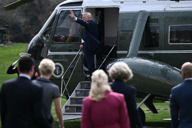 US President Donald Trump waves as he boards Marine One as he departs from the South Lawn of the White House in Washington, DC, on March 11, 2026. Trump will be making multiple stops in Kentucky and Ohio including Thermo Fisher Scientific and Verst Logistics. (Photo by Brendan SMIALOWSKI / AFP)