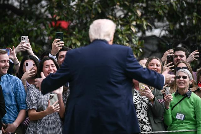 US President Donald Trump speaks to guests on his way to board Marine One as he departs from the South Lawn of the White House in Washington, DC, on March 11, 2026. Trump will be making multiple stops in Kentucky and Ohio including Thermo Fisher Scientific and Verst Logistics. (Photo by Brendan SMIALOWSKI / AFP)