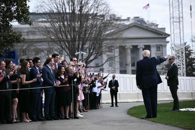 US President Donald Trump speaks with guests before boarding Marine One as he departs from the South Lawn of the White House in Washington, DC, on March 11, 2026. Trump will be making multiple stops in Kentucky and Ohio including Thermo Fisher Scientific and Verst Logistics. (Photo by Brendan SMIALOWSKI / AFP)