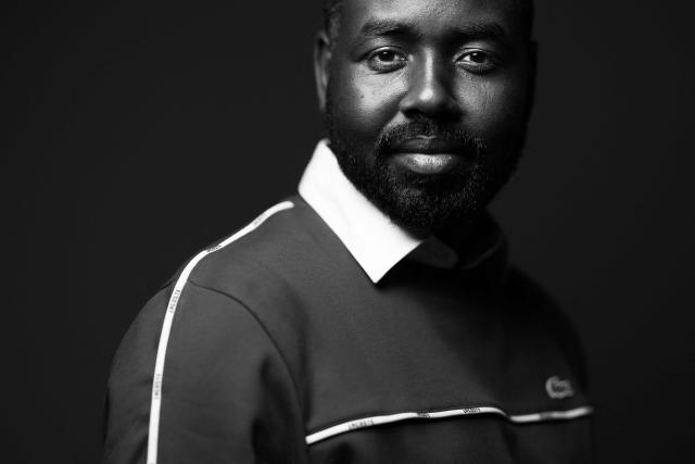 Karam Hassan, former Sudanese refugee, President and Founder of the association "The Voice of Refugees," L'Oreal ambassador, and author poses during a photo session in Paris on March 10, 2026. (Photo by JOEL SAGET / AFP)