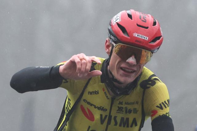 Team Visma - Lease a Bike's Danish rider Jonas Vingegaard celebrates as he crosses crossing the finish to win the 4th stage of the Paris-Nice cycling race, 195 km between Bourges and Uchon, on March 11, 2026. (Photo by Anne-Christine POUJOULAT / AFP)