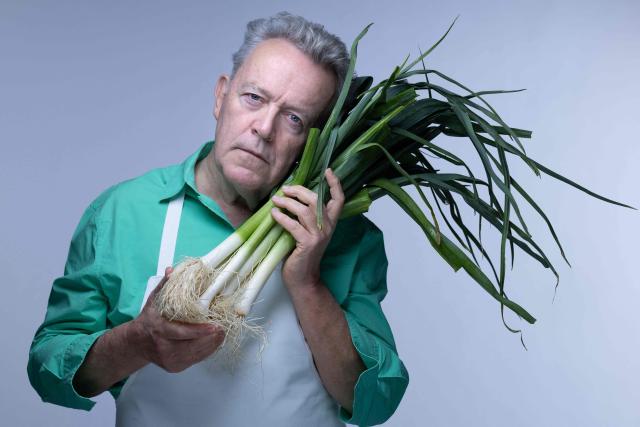 Michelin-starred French chef Alain Passard, known for his exclusively vegetable-based cuisine, poses with vegetables from his garden, during a photo session in Paris on March 6, 2026. (Photo by JOEL SAGET / AFP)