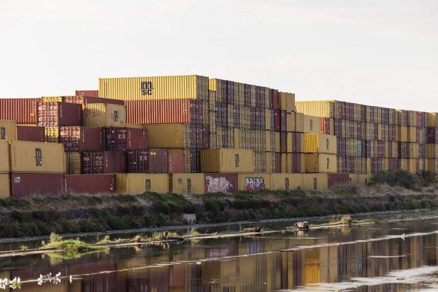 A general view of containers stacked up in the proximity of the Cape Town Harbour on March 11, 2026. (Photo by GIANLUIGI GUERCIA / AFP)