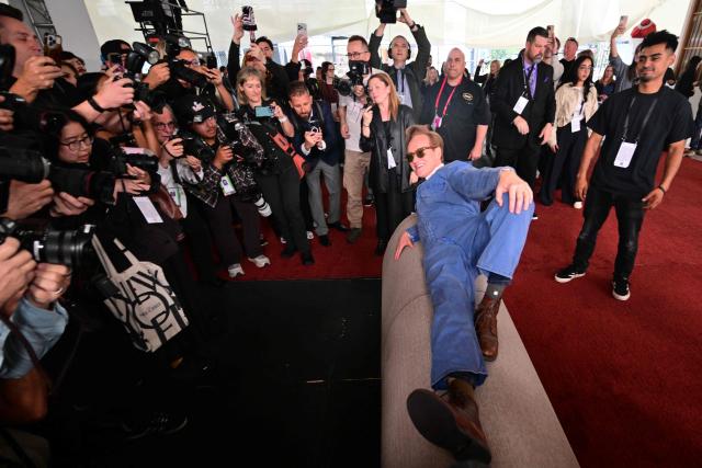 Host Conan O'Brien lies on the carpet as he participates in the 98th Oscars arrivals carpet roll out at the Dolby Theatre at Ovation in Hollywood, California on March 11, 2026, ahead of the Academy Awards on March 15. (Photo by Frederic J. Brown / AFP)