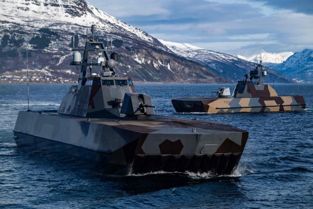 Two Skjold-class Corvettes of the Norwegian Navy manoeuvre off the coast of Harstad on March 11, 2026, as NATO conducts its Cold Response military exercise. The Norwegian-led winter exercise involves 32.000 troops, 100 aircraft, and 30 warships from 14 nations taking part in high intensity, multi-domain operations in an arctic climate. (Photo by John MACDOUGALL / AFP)
