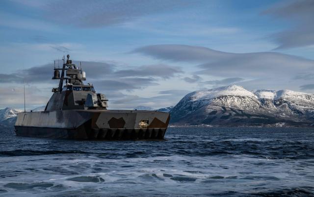 A Skjold-class Corvette of the Norwegian Navy manoeuvres off the coast of Harstad on March 11, 2026, as NATO conducts its Cold Response military exercise. The Norwegian-led winter exercise involves 32.000 troops, 100 aircraft, and 30 warships from 14 nations taking part in high intensity, multi-domain operations in an arctic climate. (Photo by John MACDOUGALL / AFP)