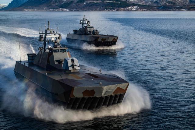 Two Skjold-class Corvettes of the Norwegian Navy manoeuvre off the coast of Harstad on March 11, 2026, as NATO conducts its Cold Response military exercise. The Norwegian-led winter exercise involves 32.000 troops, 100 aircraft, and 30 warships from 14 nations taking part in high intensity, multi-domain operations in an arctic climate. (Photo by John MACDOUGALL / AFP)