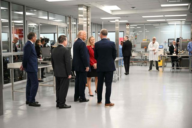US President Donald Trump tours Thermo Fisher Scientific laboratories in Cincinnati, Ohio, on March 11, 2026. Trump is meeting with Thermo Fisher officials to discuss prescription drug prices. (Photo by Jim WATSON / AFP)