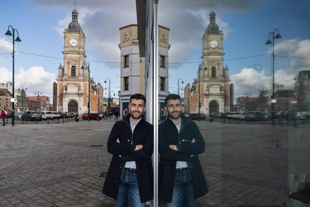 Rassemblement National (RN) mayoral candidate in Lens, Bruno Clavet poses for a photograph in front of the city hall of Lens, northern France, on March 11, 2026. (Photo by Sameer Al-DOUMY / AFP)