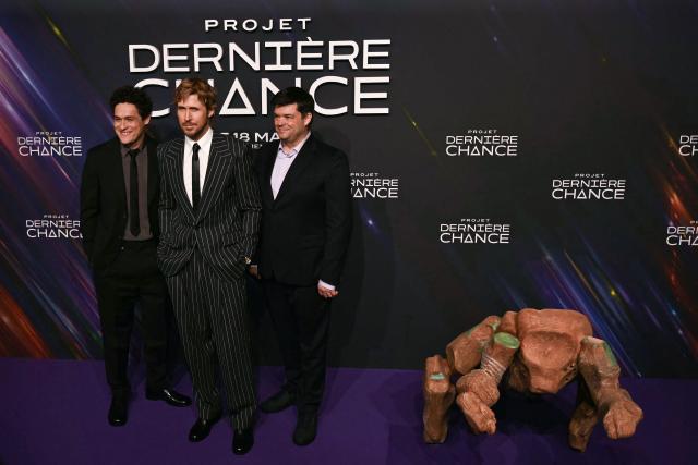 (From L) US producer Phil Lord, Canadian actor Ryan Gosling and writer US film producer writer Christopher Miller pose during a photocall before the screening of the movie 'Project Hail Mary' (Projet Dernière Chance) at the Pathe Palace Theater in Paris on March 11, 2026.  (Photo by Martin LELIEVRE / AFP)