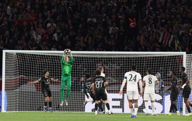 Paris Saint-Germain's Russian goalkeeper #39 Matvey Safonov grabs the ball during the UEFA Champions League round of 16 first leg football match between Paris Saint-Germain (PSG) and Chelsea at the Parc des Princes stadium in Paris on March 11, 2026. (Photo by ALAIN JOCARD / AFP)