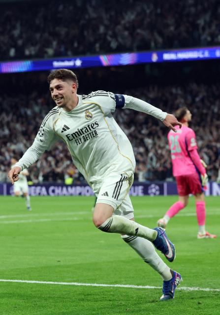 Real Madrid's Uruguayan midfielder #08 Federico Valverde celebrates scoring the opening goal during the UEFA Champions League last 16 first leg football match between Real Madrid CF and Manchester City at Santiago Bernabeu Stadium in Madrid on March 11, 2026. (Photo by Pierre-Philippe MARCOU / AFP)