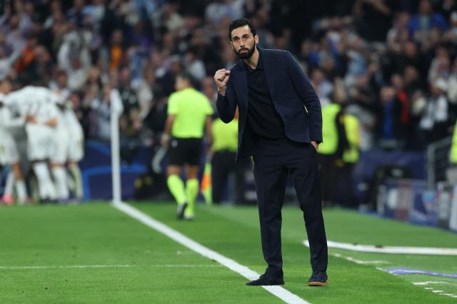 Real Madrid's Spanish coach Alvaro Arbeloa celebrates the opening goal during the UEFA Champions League last 16 first leg football match between Real Madrid CF and Manchester City at Santiago Bernabeu Stadium in Madrid on March 11, 2026. (Photo by Thomas COEX / AFP)