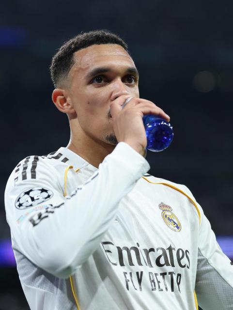 Real Madrid's English defender #12 Trent Alexander-Arnold drinks during the UEFA Champions League last 16 first leg football match between Real Madrid CF and Manchester City at Santiago Bernabeu Stadium in Madrid on March 11, 2026. (Photo by Thomas COEX / AFP)