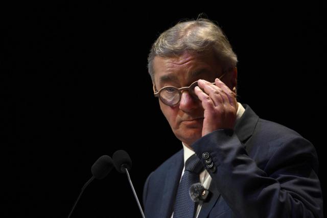 Toulouse Mayoral candidate Francois Briancon (R) of "La Gauche Unie" speaks an election campaign in Toulouse on March 11, 2026, ahead of first round of municipal elections in France. (Photo by Ed JONES / AFP)