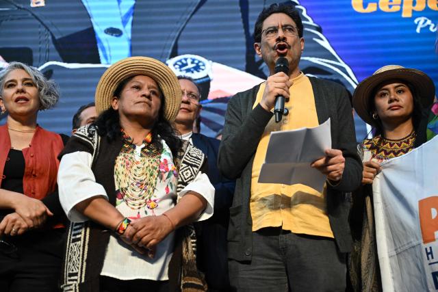 Colombian presidential candidate Ivan Cepeda speaks next to his vice-presidential running mate Aida Marina Quilcue (2nd L) after registering their candidacy at the National Registry in Bogota on March 11, 2026. (Photo by RAUL ARBOLEDA / AFP)