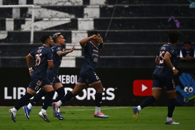 Carabobo's midfielder #05 Edson Castillo (C) celebrates with teammates after scoring the opening goal during the Copa Libertadores phase three second-leg football match between Peru's Sporting Cristal and Venezuela's Carabobo at the Alberto Gallardo Stadium in Lima on March 11, 2026. (Photo by ERNESTO BENAVIDES / AFP)