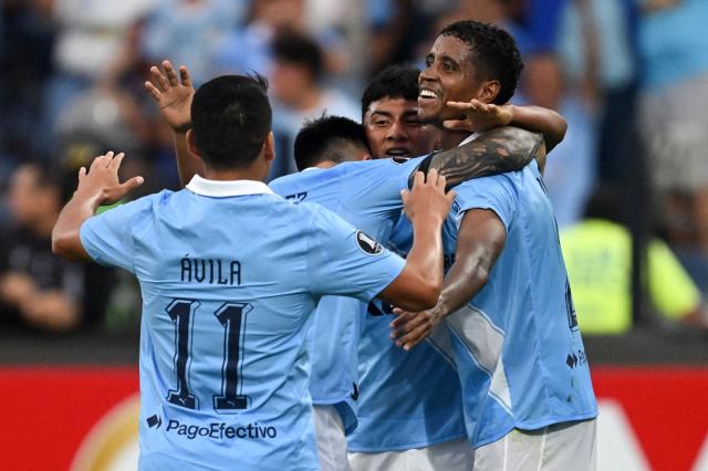 Sporting Cristal's forward #23 Maxloren Castro (2nd R) celebrates with teammates after scoring his team's first goal during the Copa Libertadores phase three second-leg football match between Peru's Sporting Cristal and Venezuela's Carabobo at the Alberto Gallardo Stadium in Lima on March 11, 2026. (Photo by ERNESTO BENAVIDES / AFP)
