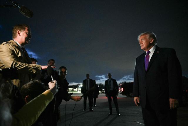 US President Donald Trump speaks to journalists upon returning to Joint Base Andrews, Maryland on March 11, 2026. Trump is returning to the White House following a visit to Kentucky and Ohio. (Photo by Jim WATSON / AFP)